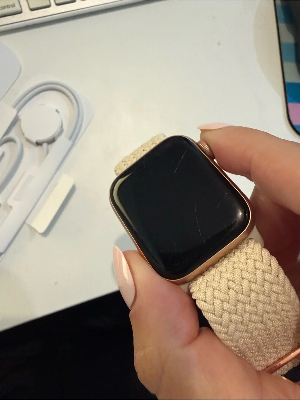 Apple Watch SE with band and charger
